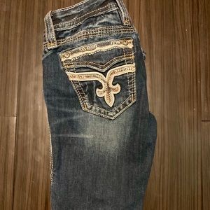 Size 25 skinny rock revivals.